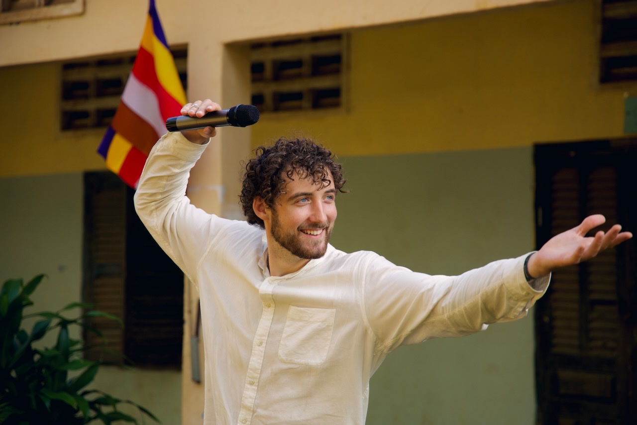 Chris preaching at a school outreach in Cambodia, 2024