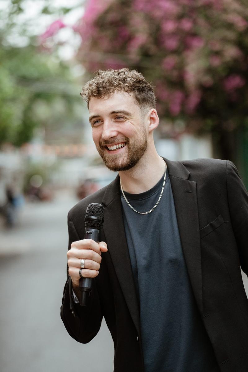 Chris Cashen holding a microphone