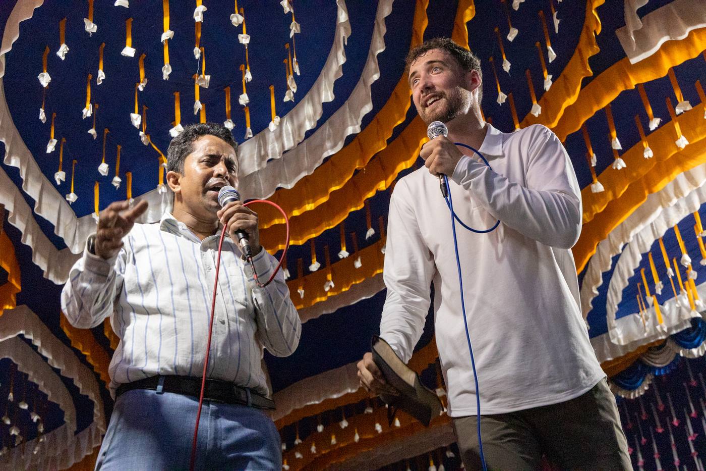 Chris and his interpreter preaching at a crusade in Bangladesh